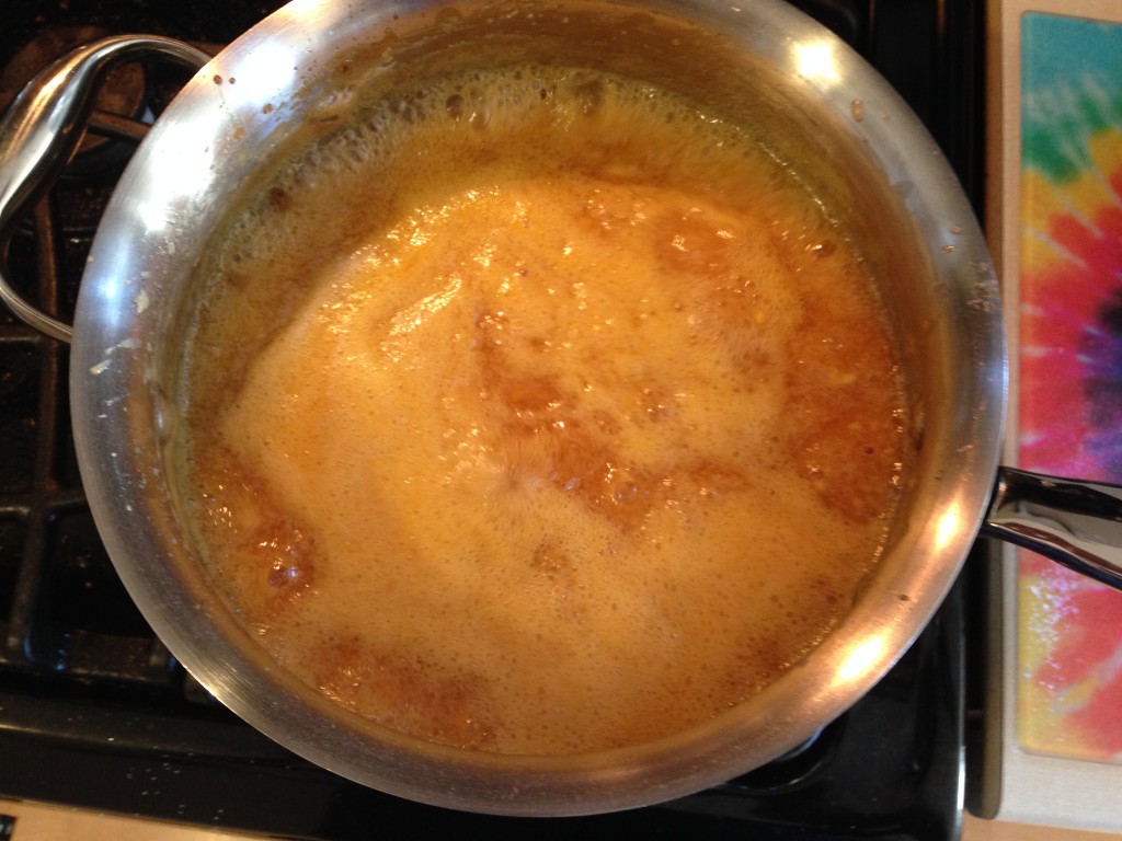 Peach jam cooking on the stove.